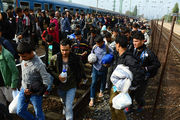 A photograph taken on October 6, 2015 of a group of refugees leaving Hungary on their way to Germany. 