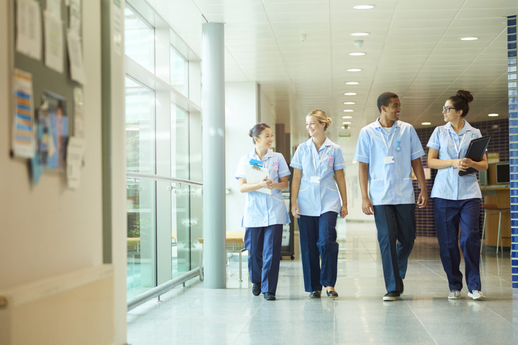 A photo of nurses in a hospital corridor. 