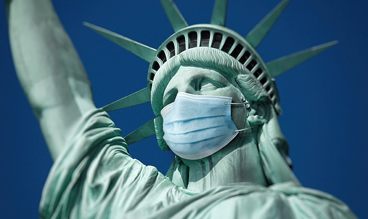 Perfect Storm: The Impact of the Coronavirus Crisis on International Student Mobility to the United States Lead image: Photo montage showing the Statue of Liberty wearing a mask 