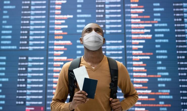 The Proposed Elimination of “Duration of Status”: A Threat to International Student Mobility Lead Image: Photo depicting an international student checking flight times at an airport