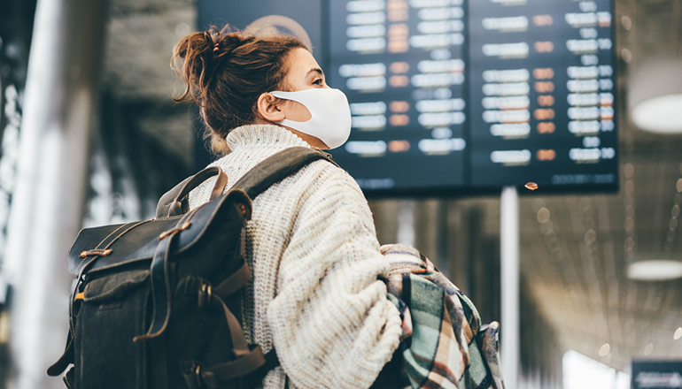Supporting the Recovery and Resiliency of International Education in the U.S. Lead Image: Masked international student at an airport