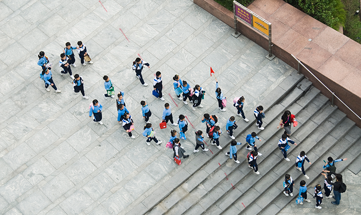 Alike but Unequal: China’s International High School Sector Lead Image: A photo of uniformed Chinese students heading to school